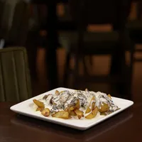 Пекарски компир со фунги сос — Arena Restaurant & Playground, Струмица